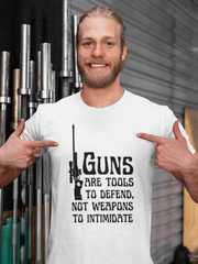 Guns are tools to defend, not weapons to intimidate Unisex Softstyle T-Shirt